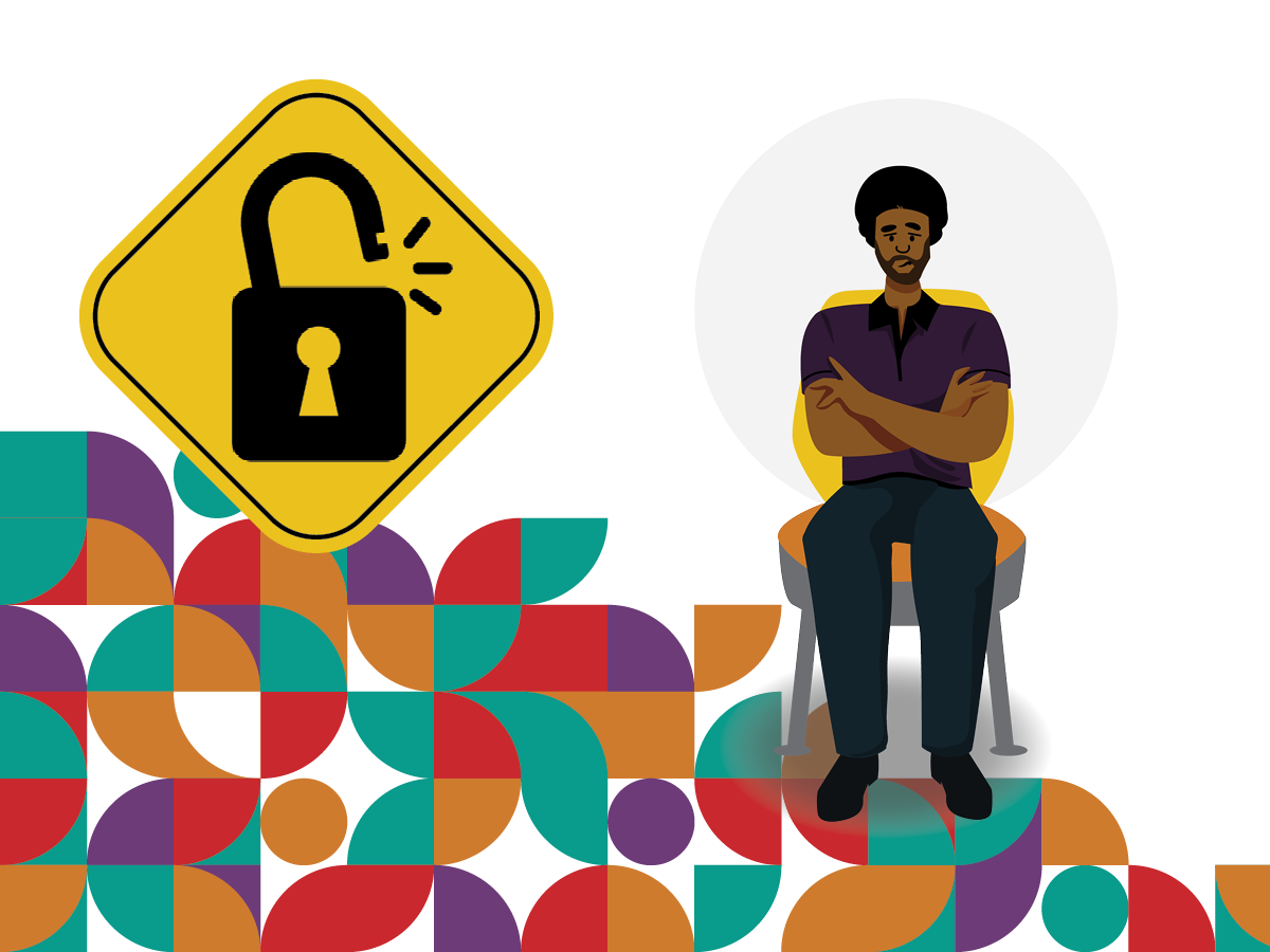 A concerned Black man with arms crossed sits on a chair next to a road sign with symbol of lock.