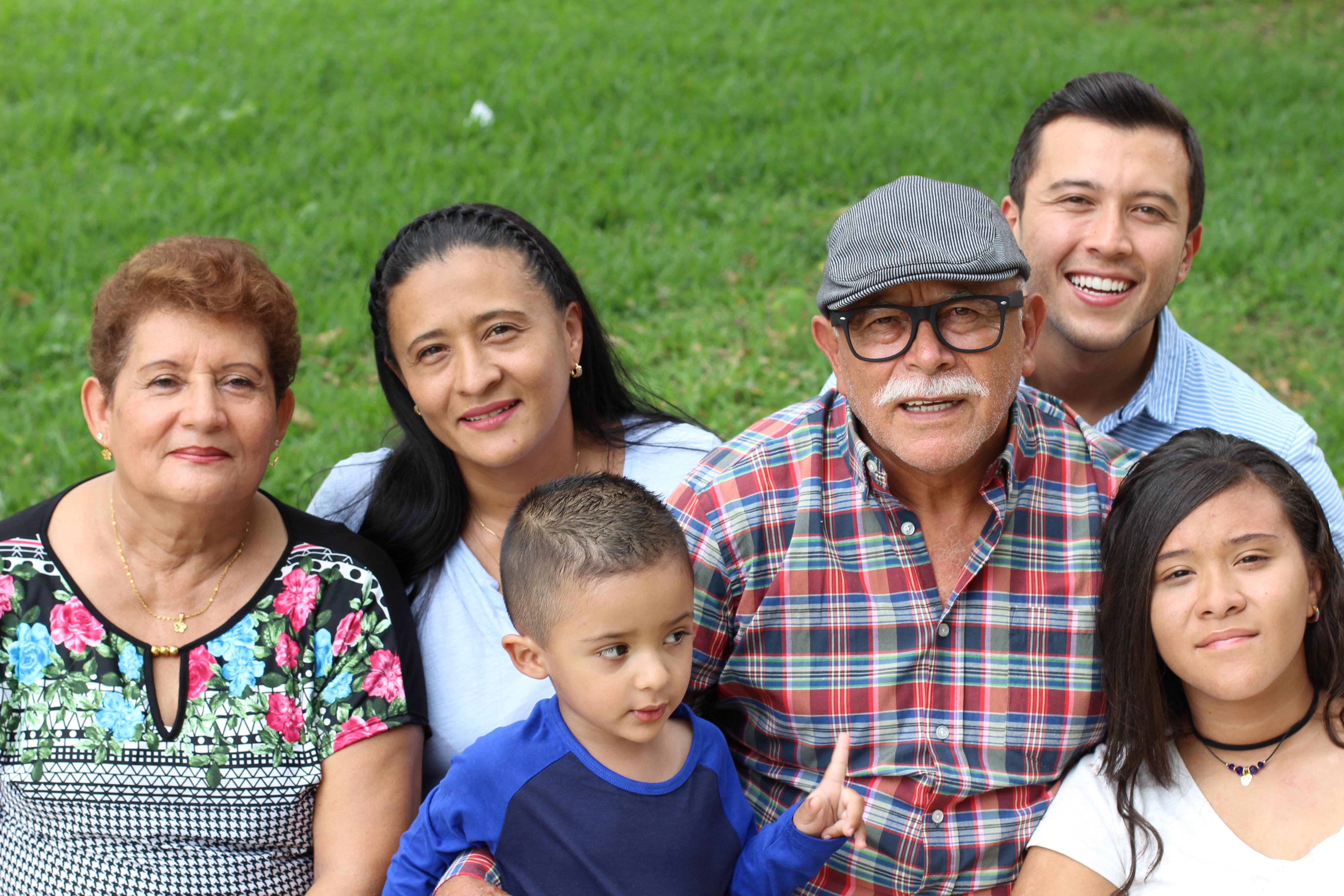 Family standing on a lawn