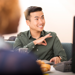 Person uses sign language in a meeting.